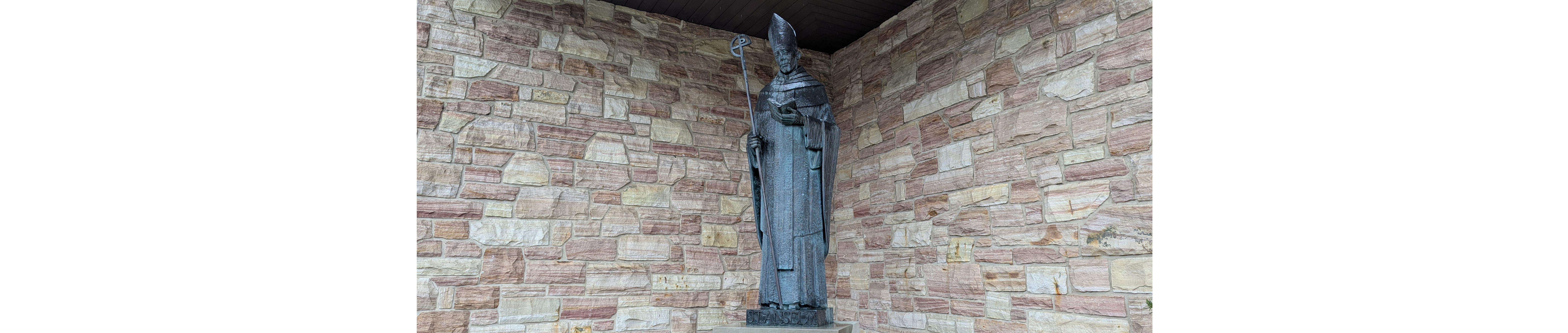 Statue of St. Anselm outside church.